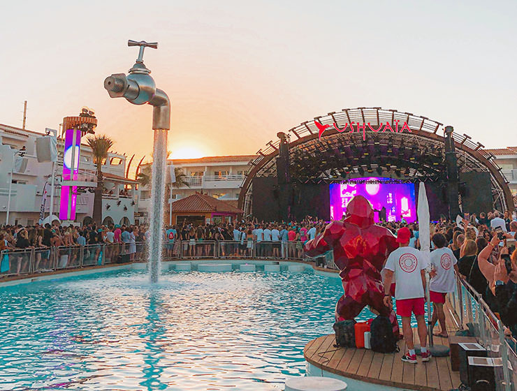 People at a pool party in Ibiza, one of the overcrowded destinations that want to bring party tourism under control; photo by David Svihovec, Unsplash.