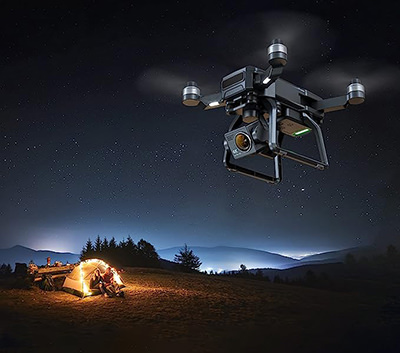 Bwine F7 drone flying at night time above a camping scene; one of the hot summer deals on Amazon.