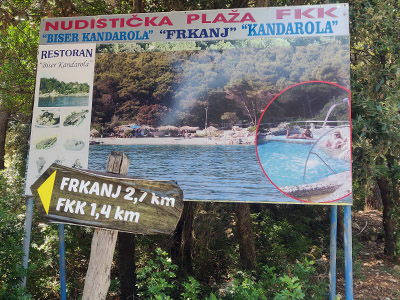 Billboard on the road from Kampor to Suha Punta advertising FKK Kandarola Beach and Biser Kandarola restaurant; photo by Ivan Kralj.