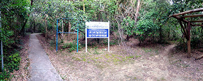 City's signboard for FKK Kandarola Beach on Rab Island in the forest of Frkanj peninsula; photo by Ivan Kralj.