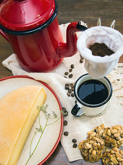 Coffee served next to cheese and cookies in Minas Gerais, one of the top coffee destinations in Brazil; photo by Marcella Pio, Unsplash.