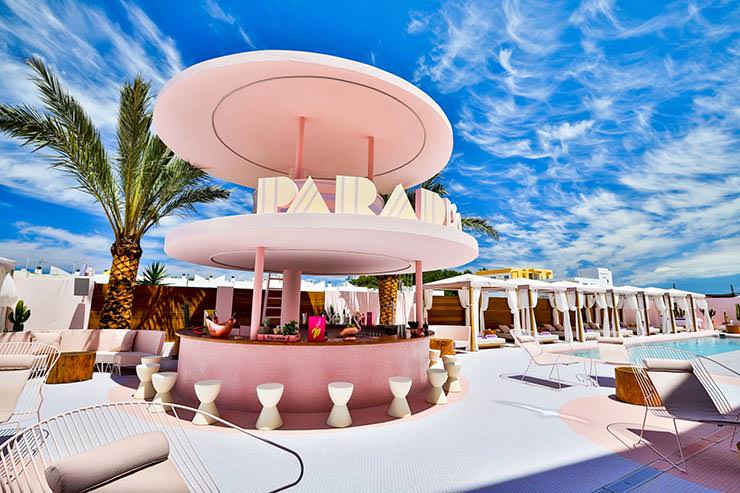 Pink-hued pool area with a bar at Paradiso Ibiza Art Hotel in Spain; photo by Paradiso.