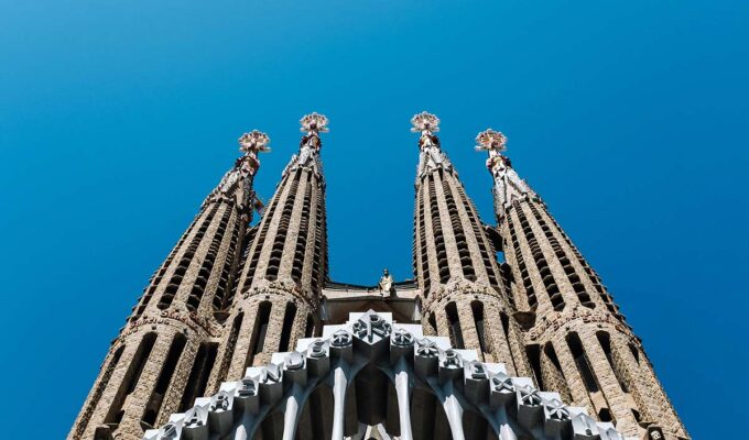 Towers of Antoni Gaudi's basilica Sagrada Familia in Barcelona, Spain, a must stop for the first European trip; photo by Ashim D'Silva, Unsplash.