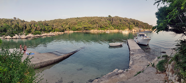 Boats anchored at peaceful Suha Punta or Matovica Beach with FKK Kandarola peninsula on the other side of the bay; photo by Ivan Kralj.