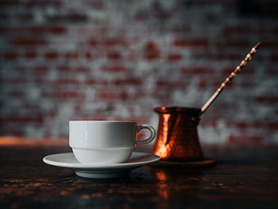 Turkish coffee cup and traditional pot cezve; photo by Dex Ezekiel, Unsplash.