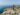 A couple on a honeymoon in Croatia, hugging with the panorama of Dubrovnik in the background; photo by Shevtsovy, Depositphotos.