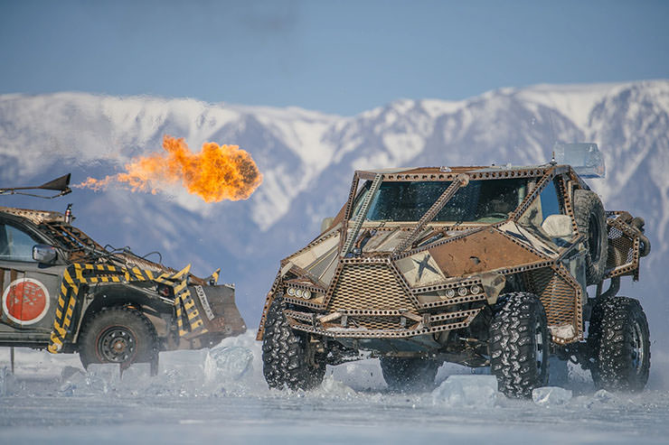 Madway Rally cars modified in Mad Max-style, blowing fire, and driving over the frozen Lake Baikal, Russia.