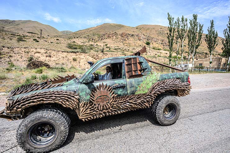 Customized Mad Max-style car driving through Kyrgyzstan, during the MadWay Rally.