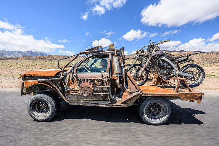 Evacuator car transporting motorbikes during the MadWay Rally in Kyrgyzstan.