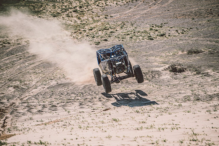Car flying through the air during the MadWay Rally in Mongolia.