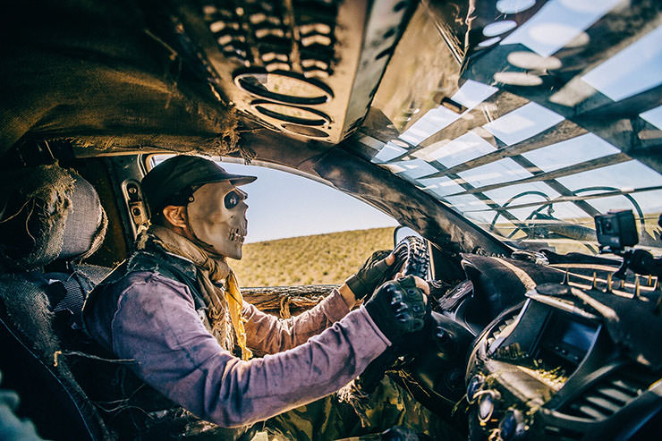 Man in a skeleton mask driving a pimped-up car during the MadWay Rally in Mongolia, an annual event inspired by "Mad Max" movie.
