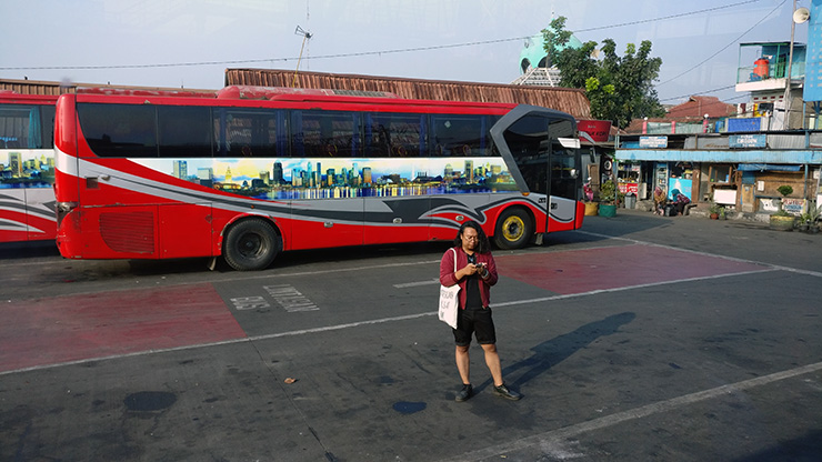 Fathin Naufal standing at the bus station in Bandung, Indonesia; photo by Ivan Kralj.