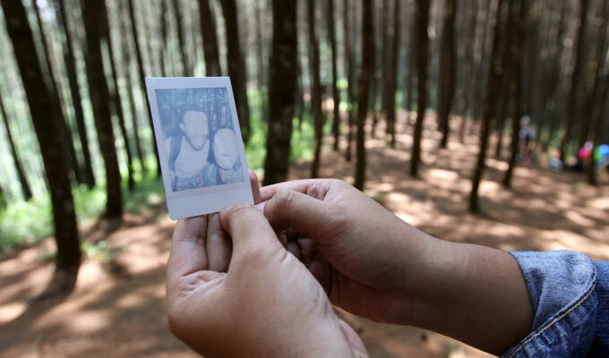Polaroid photo of Ivan Kralj and Fathin Naufal developing during their visit to Bukit Moko hill above Bandung, Indonesia; photo by Ivan Kralj