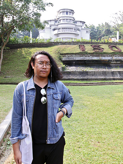 Late interior designer Fathin Naufal standing in front of the Villa Isola, serving as a headmastership office of Indonesia University of Education; photo by Ivan Kralj.