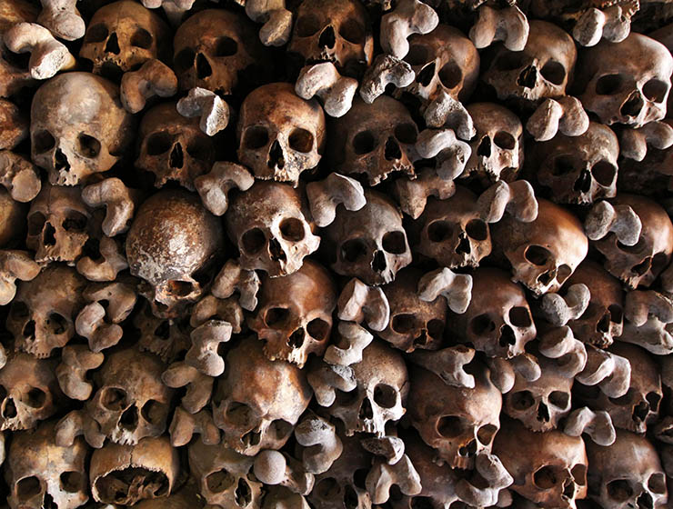 Frame filled with skulls of parishioners that were once buried in the small cemetery of St. Stephan's Church, but after issues with available space, had to be dug out and displayed in a form of a skull wall at Beinhaus Leuk, Switzerland; photo by Ivan Kralj.