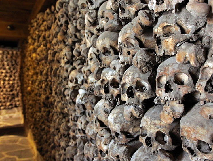 Leuk Charnel House skulls displayed in a form of a wall in the basement of St. Stephan's Church, under a video surveillance; photo by Ivan Kralj.