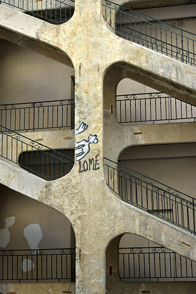 Six-floor stairway with traboule, a covered passage through a courtyard building Cour des Voraces in Lyon, France, one of the unmissable things to see in every Lyon itinerary; photo by Renaud Confavreux, Unsplash.