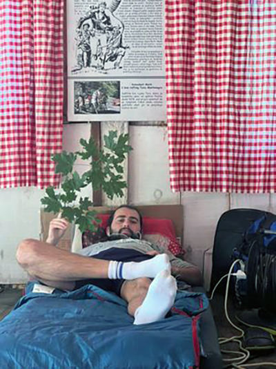 Filip Knežević lying down in bed, as one of the two winners of Montenegro's competition for the laziest citizen; private photo album.