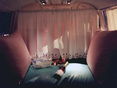 The interior of Flamingo Air's Amelia plane, adapted for mile high club charter flights, with a bottle of Champagne on the bed; photo by Flamingo Air.