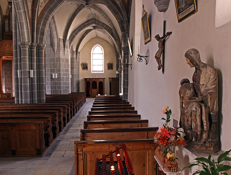 The interior of St. Stephan's Church in Leuk, Switzerland, with valuable Pieta and crucifix discovered in the piles of bones in Leuk's ossuary; photo by Ivan Kralj.