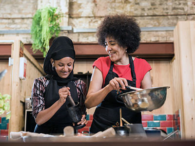 Eatwith London, chef Nazareth leading an Ethiopian cooking class; photo by Eatwith.