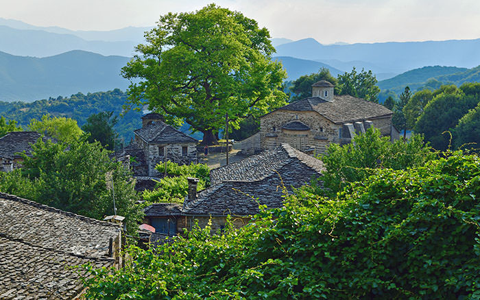 Mikro Papigo or Papingo, one of the Zagori villages with centered around gigantic old tree, Zagorochoria, Greece; photo by Orientalizing.