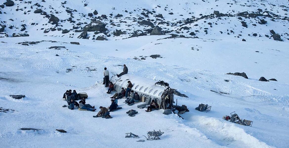 Society of the Snow, a group of Uruguayan rugby players, survivors of a 1972 plane crash in snow-covered Andes, Netflix movie (2023).