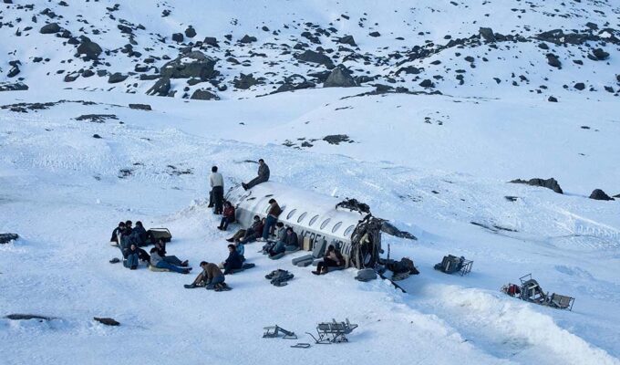 Society of the Snow, a group of Uruguayan rugby players, survivors of a 1972 plane crash in snow-covered Andes, Netflix movie (2023).