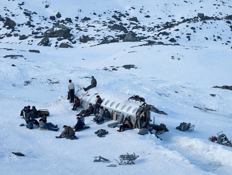 Society of the Snow, a group of Uruguayan rugby players, survivors of a 1972 plane crash in snow-covered Andes, Netflix movie (2023).