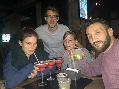 Courtney Muro, American travel blogger in Medellin, in company of her colleagues from the Spanish immersion school after class, in a bar.