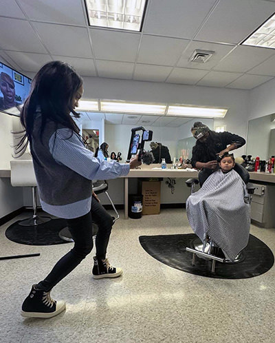 Journey Castillo, a three-year-old who visited all American national parks, being pampered at hair & make-up before a TV interview.