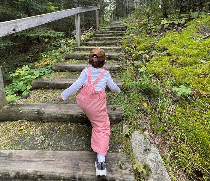 Journey Castillo climbing stairs at Kettle Falls - Voyageurs National Park, one of the 63 national parks in the U.S. she visited before turning 3 years old.