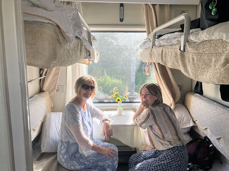 Shannon Coggins and Rosa in a train, on their slow travel, no-fly journey to Australia.