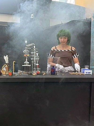 Actress Kirsty Paterson performing as Oompa Loompa character at Willy's Chocolate Experience in Glasgow, a fiasco event where some commenters compared her candy station to a meth lab; source: Facebook.