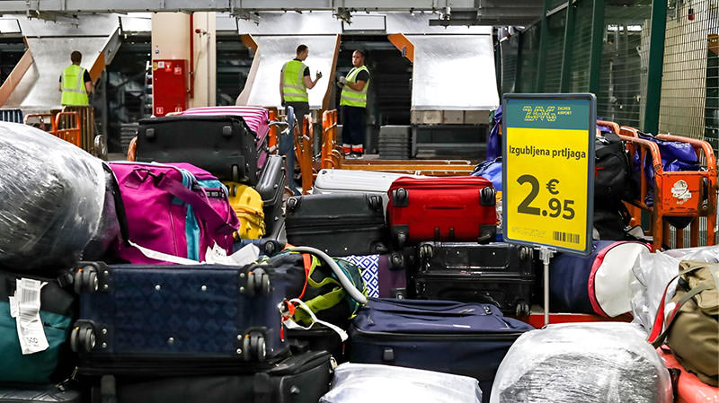 Edited photograph of a fake unclaimed baggage sale at Zagreb Airport, offering a suitcase for a price of €2.95; one of the lost luggage scams that tricked Facebook users in handing over credit card details to fraudsters. The actual scene in this stolen and photoshopped image is shot at Sheremetyevo Airport in Moscow by a photographer Stanislav Krasilnikov / TASS.
