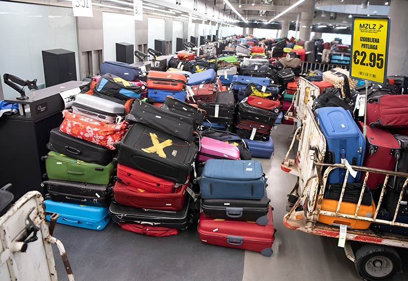 Edited photograph of a fake unclaimed baggage sale at Zagreb Airport, offering a suitcase for a price of €2.95; one of the lost luggage scams that tricked Facebook users in handing over credit card details to fraudsters. The actual scene in this stolen and photoshopped image is shot at Frankfurt Airport by a photographer Boris Roessler / DPA.