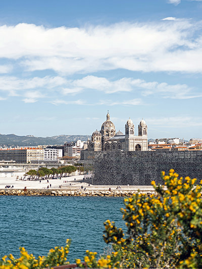 The Museum of European and Mediterranean Civilizations (MUCEM) with Marseille Cathedral in the background; photo by Romain Galoche, Unsplash.