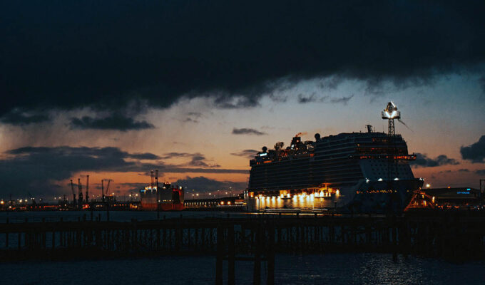 Sunset in Southampton, with the outlines of a cruise ship, nightscape; photo by Frankie Lu, Unsplash.