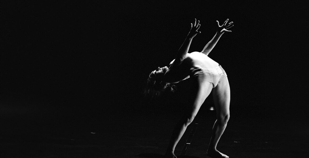 Late Angela Laurier, French-Canadian contortionist bending her spine in her performance "Deversoir" during the Festival Novog Cirkusa in Zagreb, Croatia; black-and-white photo by Jean Pierre Estournet.