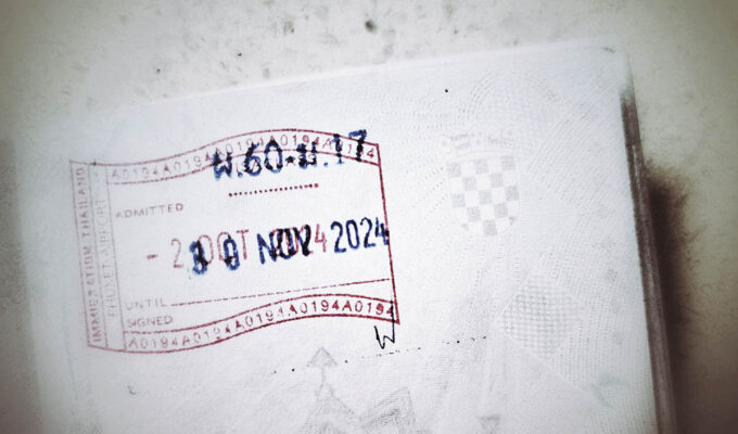Thailand immigration stamp in Croatian passport showing the entrance to the country on 20th of October 2024, and validity of visa exemption until 30th of November 2024 - the sobering proof for travel blogger Ivan Kralj who bought his flight out of Thailand on 2nd of December, believing he is respecting the 60 day stay limit, thus calling for visa overstay in Thailand; photo by Ivan Kralj.