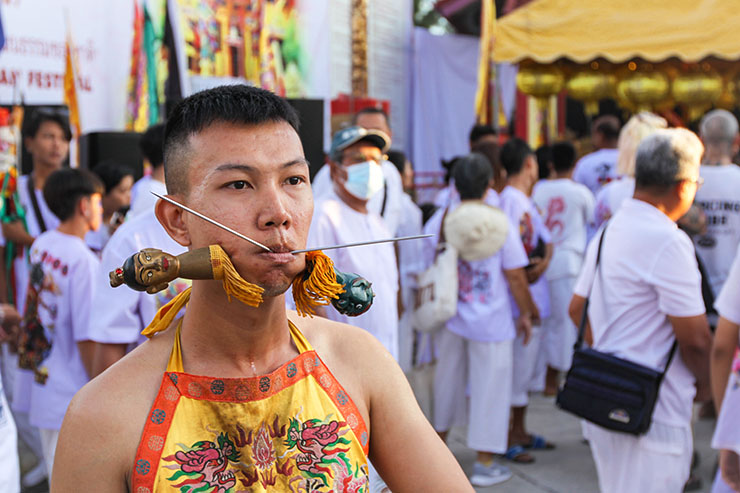 A young man with two facial piercings at Jor Soo Goong Naka Shrine, during Jay or Phuket Vegetarian Festival, also known as Thailand's self-mutilation festival; photo by Ivan Kralj.