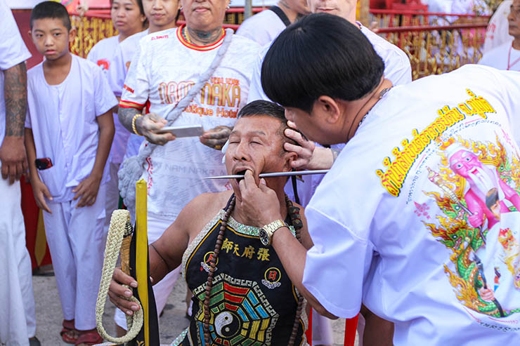 The piercing of the ma song spirit medium at Jor Soo Goong Naka Shrine, during the Phuket Vegetarian Festival, also known as Thailand's self-mutilation festival; photo by Ivan Kralj.