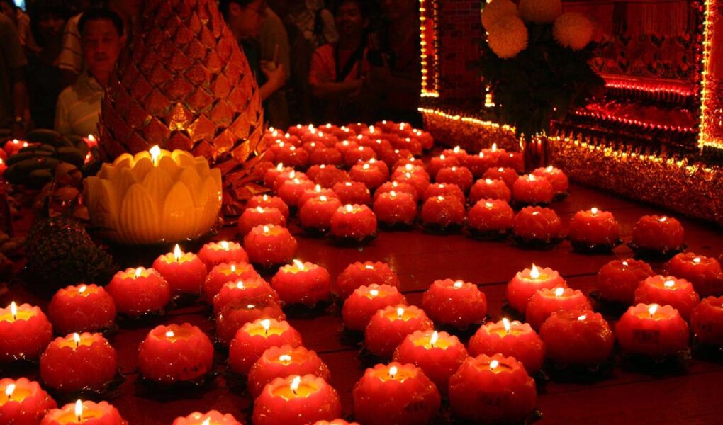 Red candles lit at the Pai Ti Kong, Hokkien New Year celebration in Penang, Malaysia; photo by Nicholas Chan.