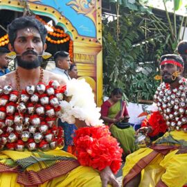 Hindu devotees carrying koodam mulle kavadi - milk pots pierced on their torsos, and their cheeks pierced with little spears (alavu kavadi) in honor of Lord Murugan, during Thaipusam Festival in Penang, Malaysia; photo by Ivan Kralj.