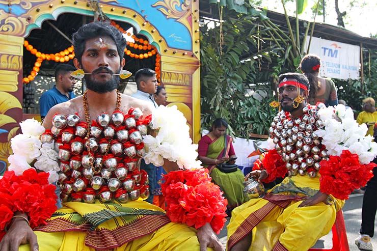 Hindu devotees carrying koodam mulle kavadi - milk pots pierced on their torsos, and their cheeks pierced with little spears (alavu kavadi) in honor of Lord Murugan, during Thaipusam Festival in Penang, Malaysia; photo by Ivan Kralj.