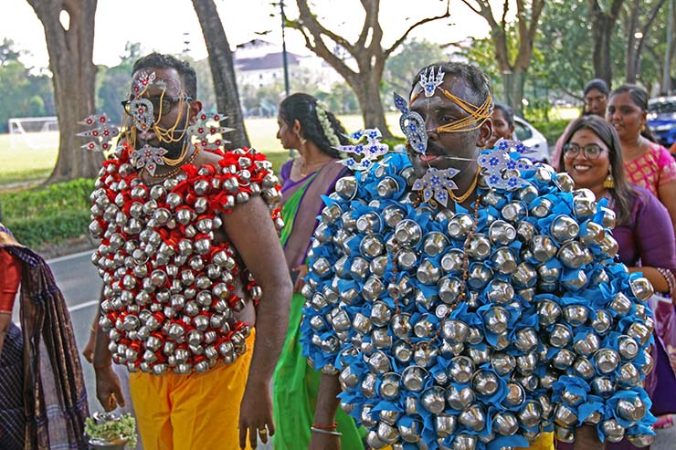 Hindu devotees carrying koodam mulle kavadi - milk pots pierced on their torsos, and their foreheads, cheeks and tongue pierced with little spears (alavu kavadi) in honor of Lord Murugan, during Thaipusam Festival in Penang, Malaysia; photo by Ivan Kralj.