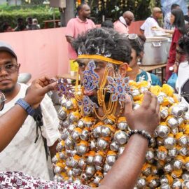 Hindu devotee carrying koodam mulle kavadi - milk pots pierced on his torso, and with forehead, cheeks and tongue pierced with little spears (alavu kavadi) in honor of Lord Murugan, during Thaipusam Festival in Penang, Malaysia; photo by Ivan Kralj.