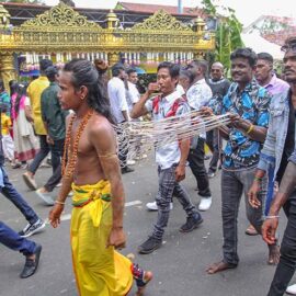 Hindu devotee pulling vette mulle kavadi (hooks with attached ropes in the skin of his back) in honor of Lord Murugan, during Thaipusam Festival in Penang, Malaysia; photo by Ivan Kralj.