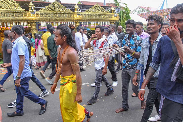 Hindu devotee pulling vette mulle kavadi (hooks with attached ropes in the skin of his back) in honor of Lord Murugan, during Thaipusam Festival in Penang, Malaysia; photo by Ivan Kralj.