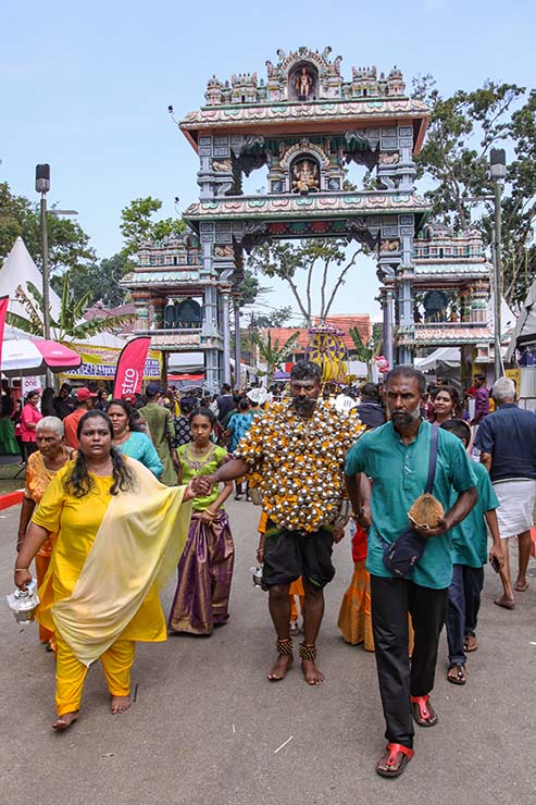 Hindu devotee carrying koodam mulle kavadi - milk pots pierced on his torso, and with cheeks pierced with a spear (alavu kavadi) in honor of Lord Murugan, during Thaipusam Festival in Penang, Malaysia; photo by Ivan Kralj.